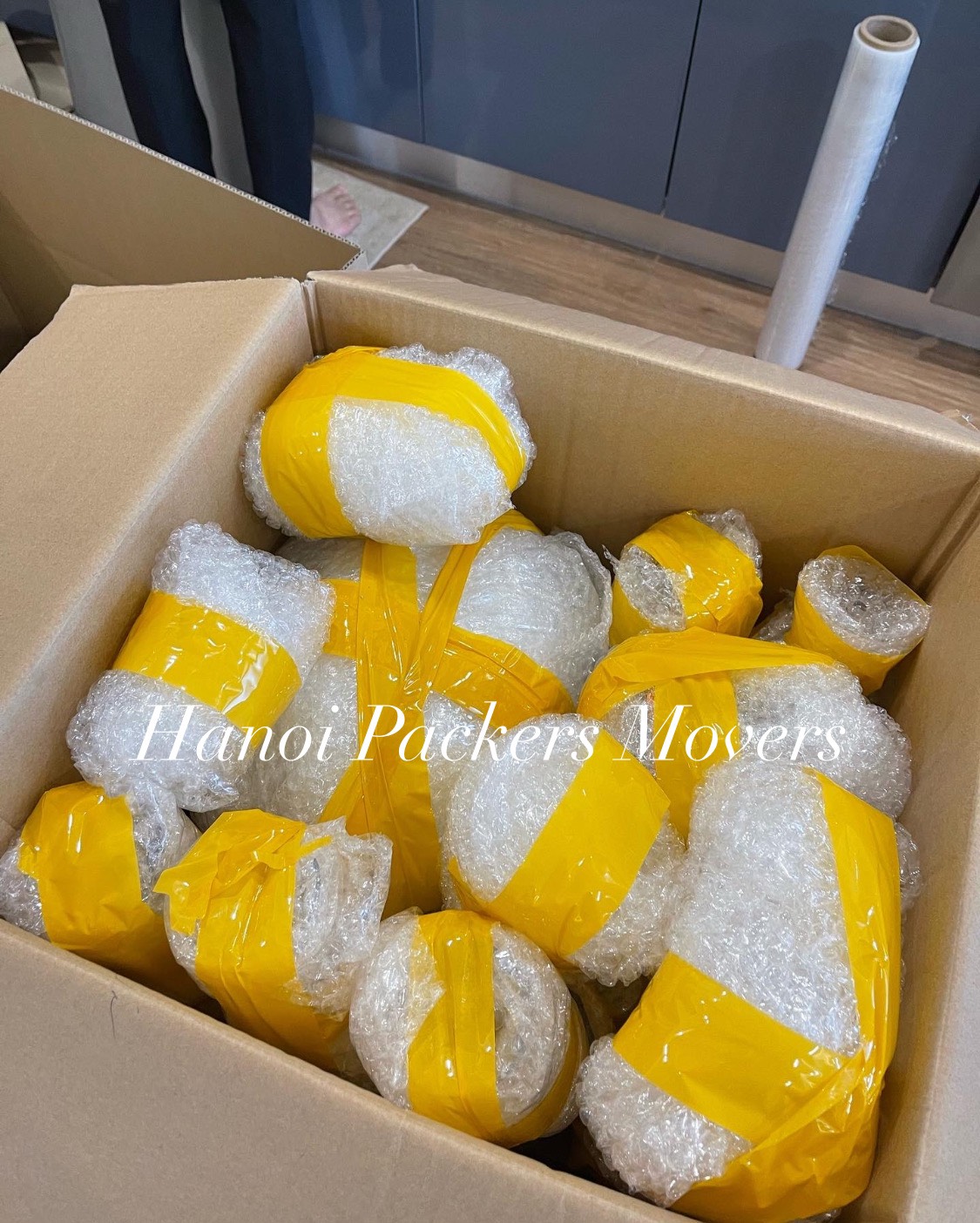 Hanoi Packers Movers packing fragile items for safe moving to Hoi An 
