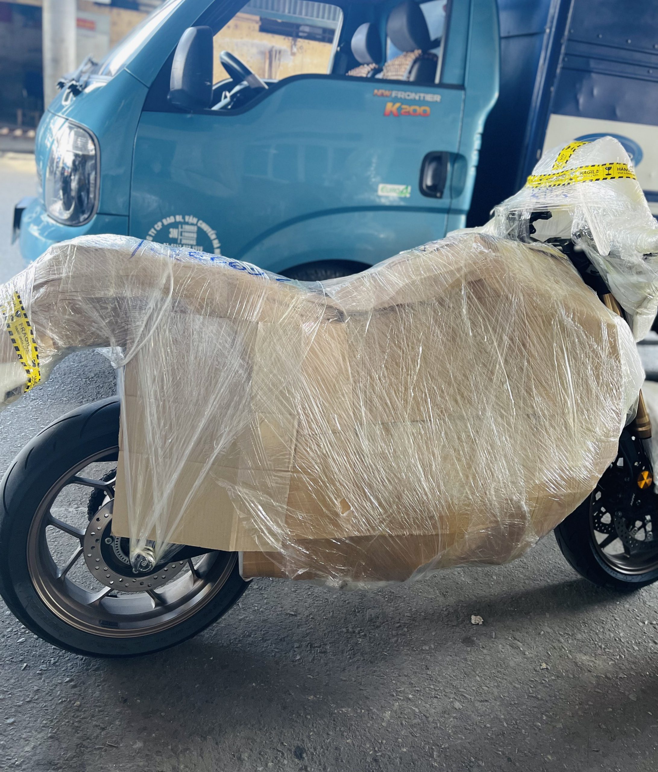 Wrapping Motorbike and Moving to Saigon by Hanoi Packers Movers 