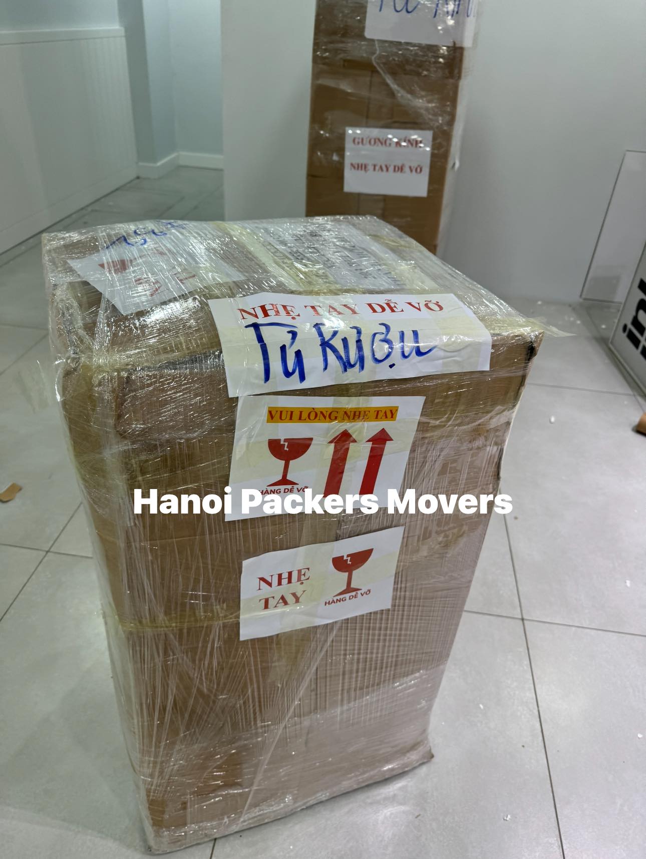 Packing and wrapping wine fridge for moving to Ho Chi Minh City
